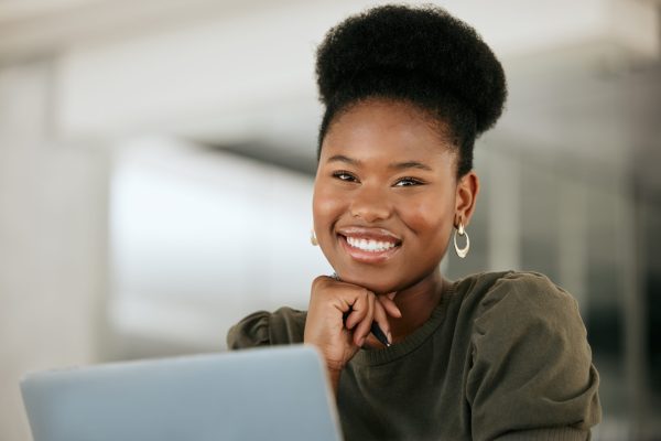 Portrait of black woman, office employee and laptop for email communication, business professional .